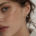 The Crossed Bow Studs